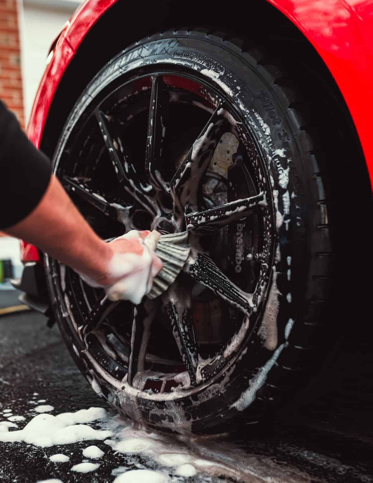 Wheels being cleaned using a soft wheel brush